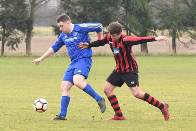Woodhall Spa Reserves (red) v Swineshead Institute A (blue). Jackson Draper (red), Kieran Gatenby (blue).