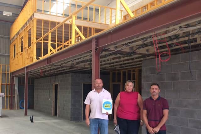 Jump Warriors backers Jonathan Graves and Nicholas Burton with Michelle Stott who will also be joining the team, pictured at the previous location on the Wainfleet Road Industial Estate in Skegness. ANL-181203-161331001