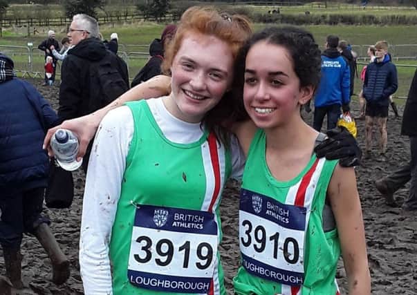Hannah Reid and Issy Dhami are all smiles after their trial by mud EMN-181203-174527002