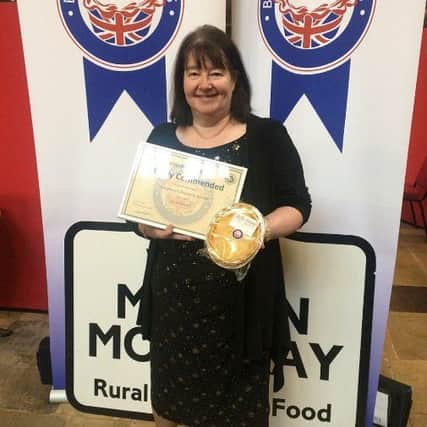 Linda North with the Highly Commended Certificate for the Chicken & Ham Pie EMN-180313-080903001