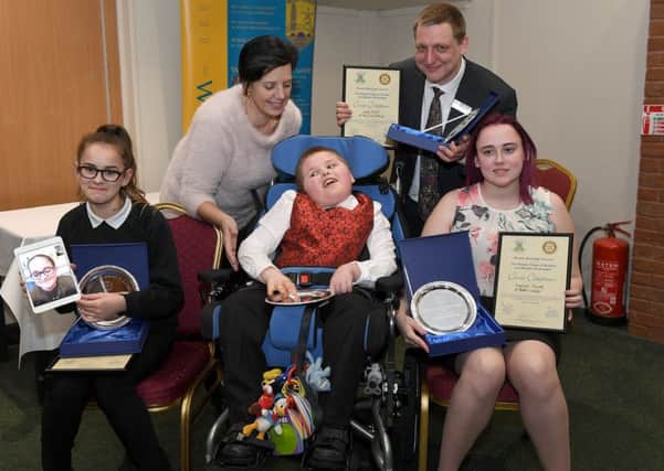 The Rotary Club of Boston and The Rotary Club of Boston St Botolph, Children of Courage Awards. L-R Ella-Louise Ingamells holding ipad with live link to her sister Kelsey Ingamells, Kim Martyn, Daniel Crewe, Andrew Castley with Lewis Smith's award, Kayleigh Tuczek. EMN-180313-093310001
