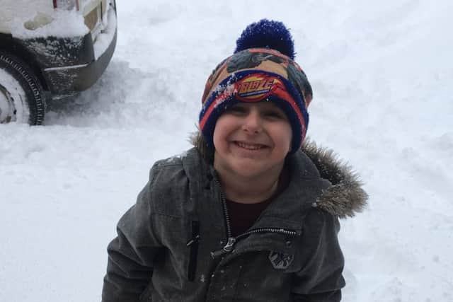 Freddy playing in the snow. EMN-180313-150648001