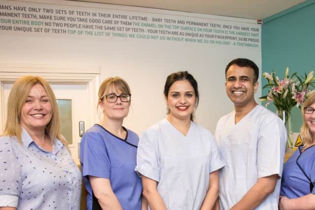 A new beginning: Smitha Susan Mathew and Manu Cherian with staff at the Horncastle practice. Photo: Supplied.