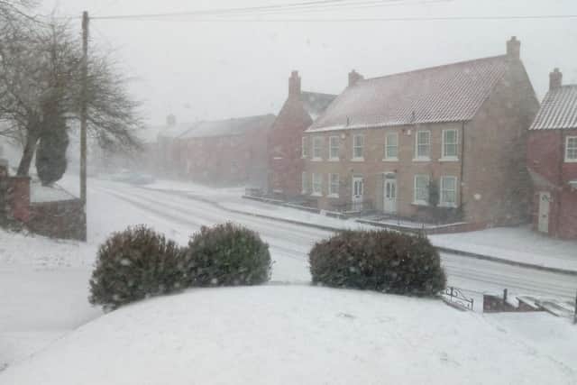 White out on the Wolds: Binbrook as the snow started to fall on Saturday EMN-180318-094704001