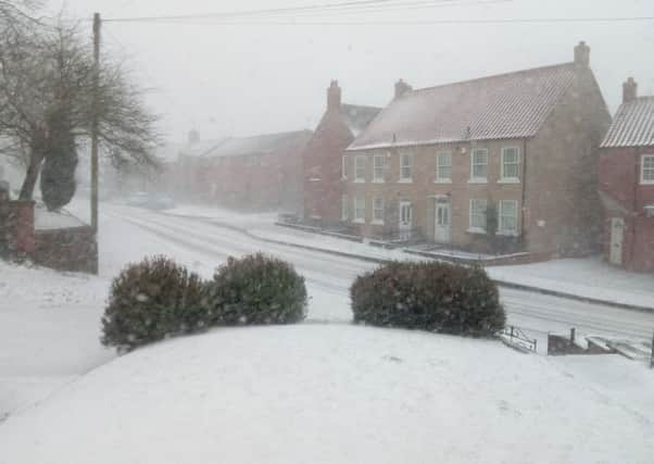 White out on the Wolds: Binbrook as the snow started to fall on Saturday EMN-180318-094704001