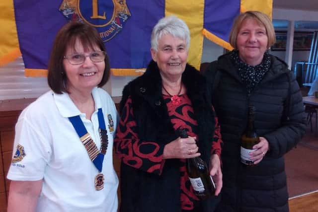 Runners-up Becky Ronan and Carol Fisher received their prizes from Lion President Pat Phillips EMN-180318-141047001