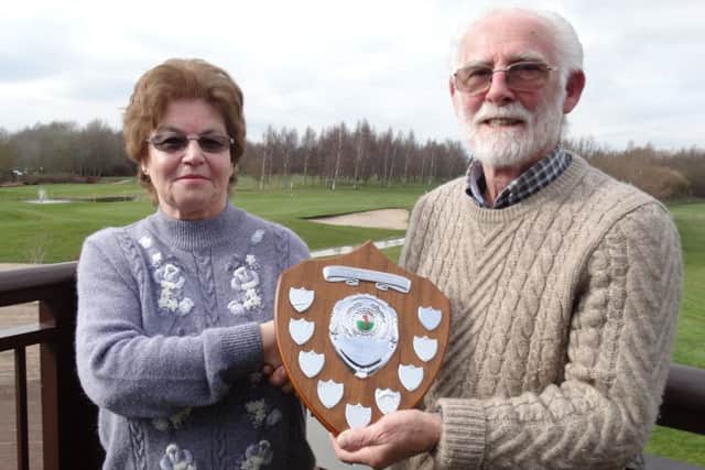 Mavis Watson presents John Wade with the Jack Watson Memorial Trophy.