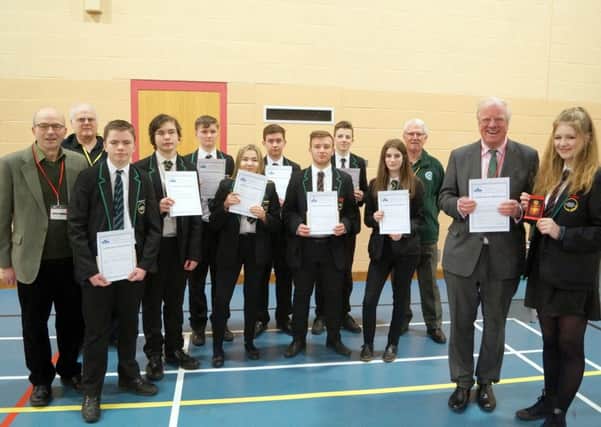 Sir Edward leigh presented certificates and badges to the hot-shot students, with Charlotte Overend (right) receiving the best shot award EMN-180319-091407001