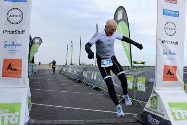 John Caborn celebrates his age group success.