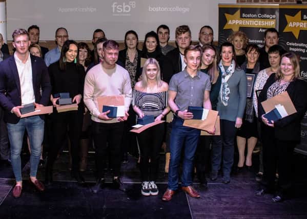 Some of the award-winning Boston College apprentices and employers. Image supplied