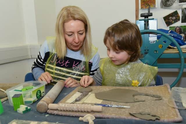 ArtsNK ceramic wind chimes workshop at Navigation Yard. Clare Lorimer and Edward Lorimer 6 of Sleaford. EMN-180320-111858001