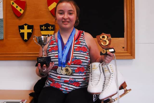 Ice skater Leah Hall with some of her impressive collection of medals and trophies. EMN-180323-170305001