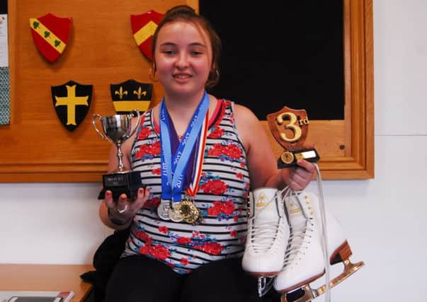Ice skater Leah Hall with some of her impressive collection of medals and trophies. EMN-180323-170305001