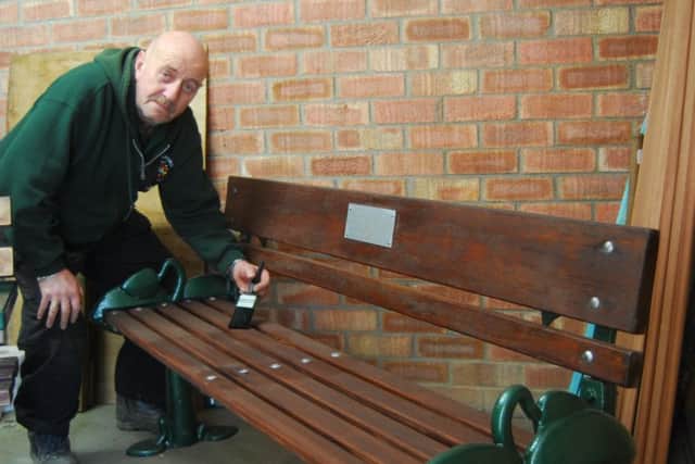 Council operative Trevor Hopkins is renovating the towns benches. EMN-180326-135322001