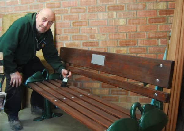 Council operative Trevor Hopkins is renovating the towns benches. EMN-180326-135322001