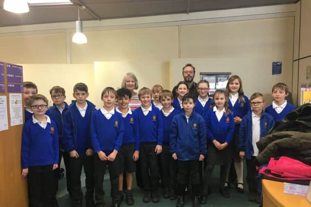 Pupils from Scamblesby CofE Primary School with town historian Shelia Jonkers. EMN-180326-114316001