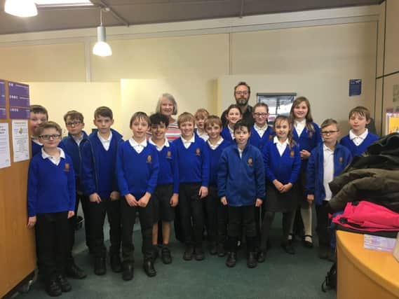 Pupils from Scamblesby CofE Primary School with town historian Shelia Jonkers. EMN-180326-114316001