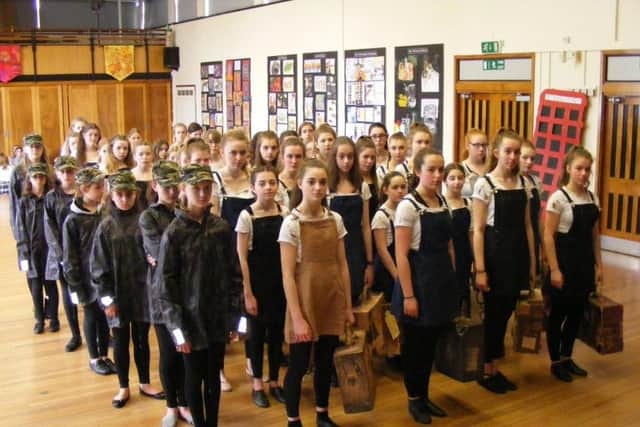 The cast of Kesteven and Sleaford High School's Rock Challenge dance piece about the plight of refugees.