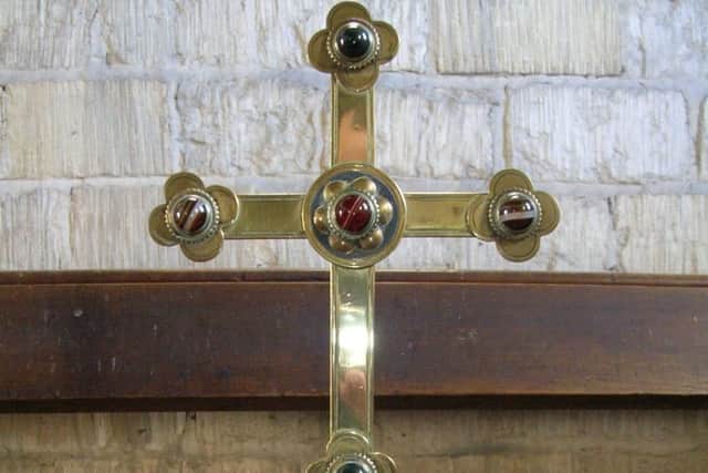 Uncaring thieves have stolen this brass cross from Dembleby parish church - have you seen it or them? EMN-180322-121709001
