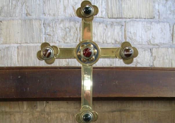 Uncaring thieves have stolen this brass cross from Dembleby parish church - have you seen it or them? EMN-180322-121709001