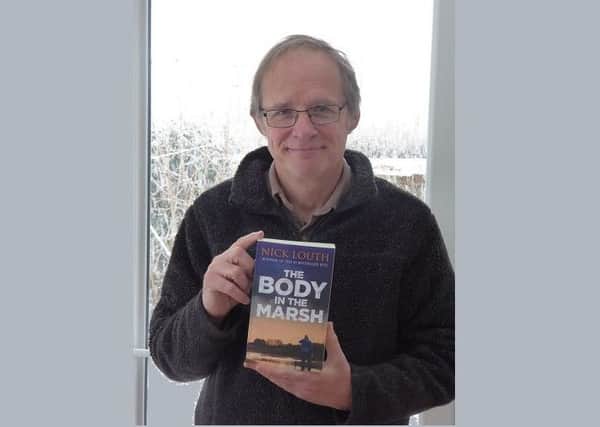 Nick Louth with his new book, 'The Body in the Marsh'.
