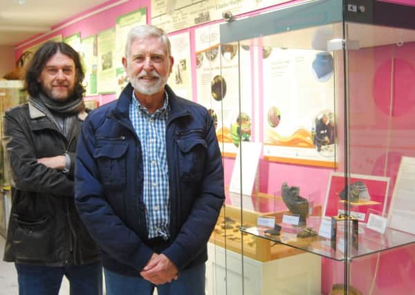 From left - chairman of Old Sleaford Heritage Group Dale Trimble with committee member James Robertson and their collection of artefacts on display at Sleaford Museum. EMN-180323-145226001
