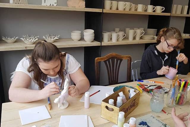 Painting pottery at 'Crackpot' in Louth.