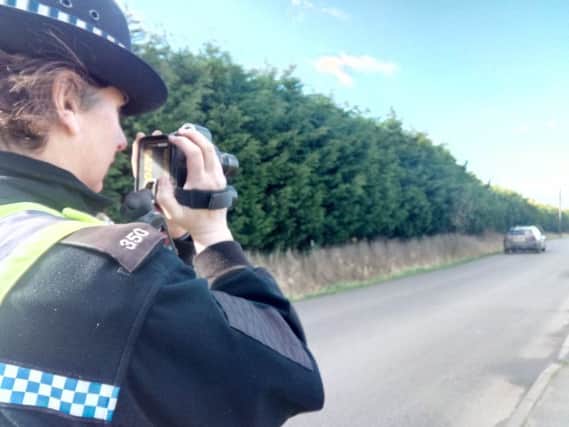 PC Sally West during a speed check in Everington's Lane, Skegness. ANL-180327-100620001
