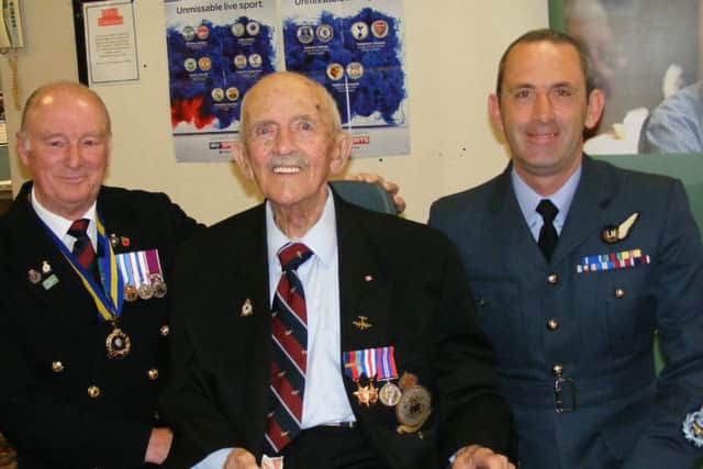 Les Andersen proudly wears his newly presented medals flanked by chairman of the Sleaford Branch of the Royal British Legion Clive Candlin and Master Aircrewman Marcus Burton of 45(R) Squadron from RAF Cranwell. EMN-180327-114929001