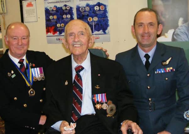 Les Andersen proudly wears his newly presented medals flanked by chairman of the Sleaford Branch of the Royal British Legion Clive Candlin and Master Aircrewman Marcus Burton of 45(R) Squadron from RAF Cranwell. EMN-180327-114929001