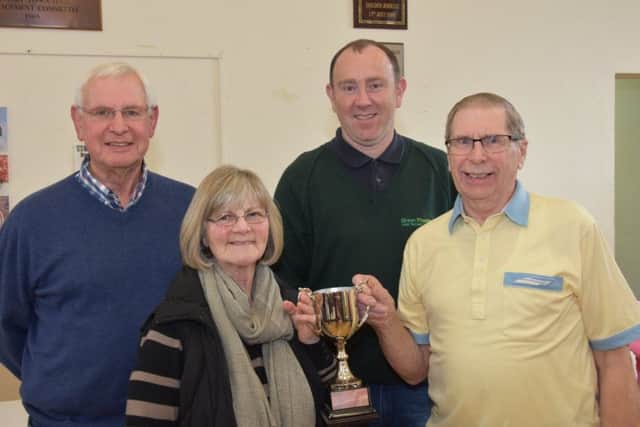 Joint winners of the Wragby Community Gardening Club Trophy are Edith Nash and Graham Osbourn, which was presented to them by show sponsor Alan Watson of Green Thumb Lawn Treatment Services, centre right also show chairman John Bird. EMN-180328-122100001