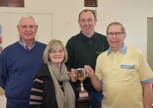 Joint winners of the Wragby Community Gardening Club Trophy are Edith Nash and Graham Osbourn, which was presented to them by show sponsor Alan Watson of Green Thumb Lawn Treatment Services, centre right also show chairman John Bird. EMN-180328-122100001