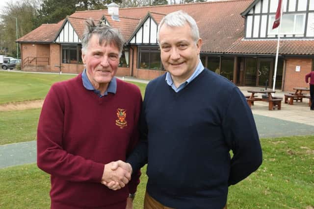 Tony Gordon from Sleaford Golf Club seniors section presenting a cheque for £2000 to CEO of Citizens Advice Mid Lincs, Stuart Hellon. EMN-180323-102440001