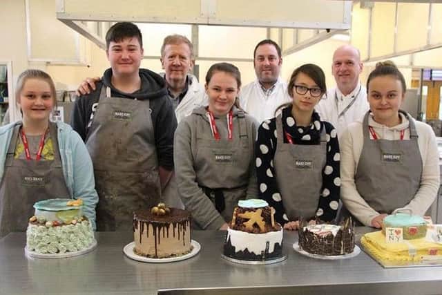 Oliver Bass (second from left) with his winning 'chokkamoccha cake'.