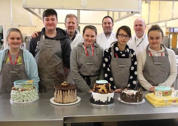 Oliver Bass (second from left) with his winning 'chokkamoccha cake'.