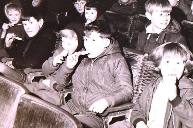 Tucking into treats at Sleaford Picturedrome in february 1969. EMN-180329-153525001