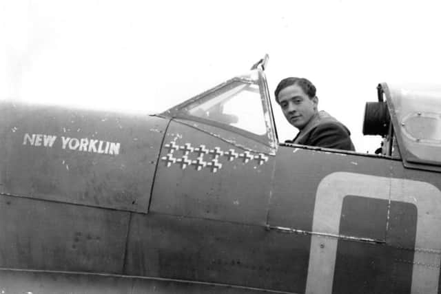 Squadron Leader RM Milne, the Commanding Officer of 92 Squadron, sitting in the cockpit of his Supermarine Spitfire Mark Vb, "New Yorklin", at Digby, Lincolnshire, in October 1941. His victory tally shows 11 enemy aircraft shot down. He was posted to command 222 Squadron in January 1942 and, one year later, became wing leader at Biggin Hill. On 20 January 1943 he shot down two Focke Wulf Fw 190s, but was then shot down himself, becoming a prisoner-of-war. EMN-180328-150941001