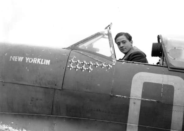 Squadron Leader RM Milne, the Commanding Officer of 92 Squadron, sitting in the cockpit of his Supermarine Spitfire Mark Vb, "New Yorklin", at Digby, Lincolnshire, in October 1941. His victory tally shows 11 enemy aircraft shot down. He was posted to command 222 Squadron in January 1942 and, one year later, became wing leader at Biggin Hill. On 20 January 1943 he shot down two Focke Wulf Fw 190s, but was then shot down himself, becoming a prisoner-of-war. EMN-180328-150941001