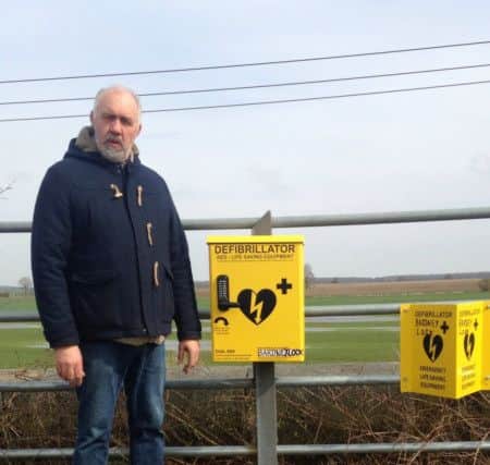 Councillor Robert Webb, Chairman BGPC, with the specialist debibrillator at Bardney Lock EMN-180804-184021001