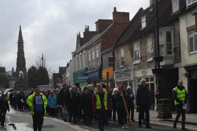 Handley Monument in the distance as around 200 people stretch back down Sleaford's Southgate on the Walk of Witness.