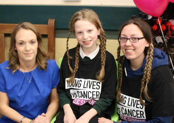 Faith-Rose and Amanda Parker, pictured before their headshave, pictured with hairdresser Melissa Ball from Sapphire Hair & Beauty.