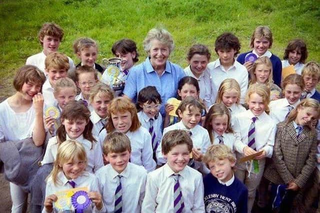 Junior Pony Club camp, members surrounding the much loved Jan Albone, from Scawby, long term member of the Pony Club committee. EMN-180904-153257001