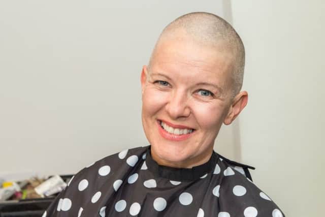 All smiles for Jane as she embraces her new look. Picture: John Aron.