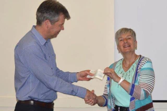 Paul Learoyd accepting a cheque for ?2,500. Photo: Mick Holmes ANL-180904-130710001