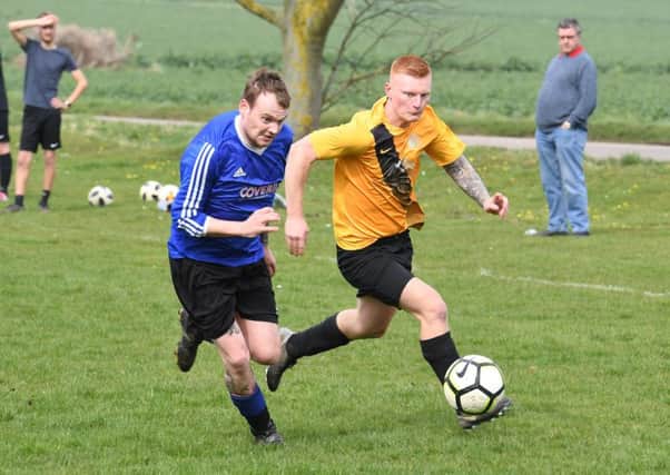 Mareham Le Fen (blue) v Eagle Utd (yellow). Dion Roberts (blue), Connor Wroot (yellow).
