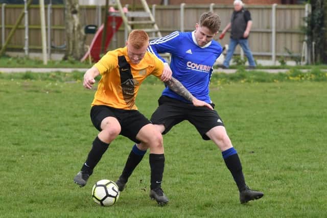 Mareham Le Fen (blue) v Eagle Utd (yellow). Connor Preston (blue), Connor Wroot (yellow).