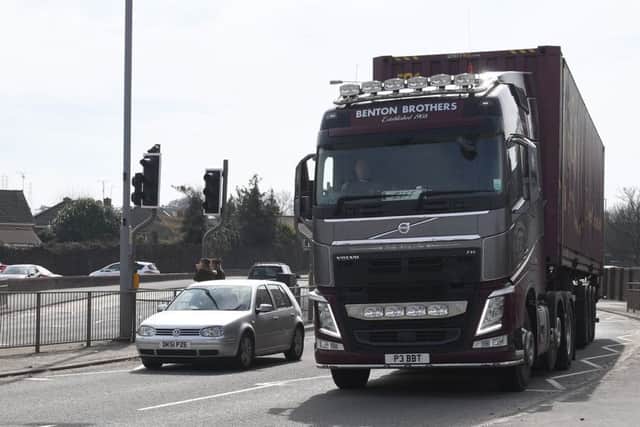 Haulage vehicles on John Adams Way. EMN-180904-093508001
