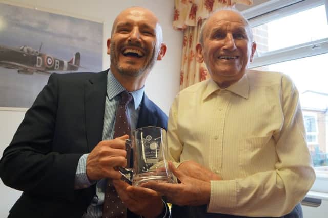 The Order of St John Care Trust CEO Dan Hayes presented Dennis Cotton with an engraved tankard EMN-180904-172326001