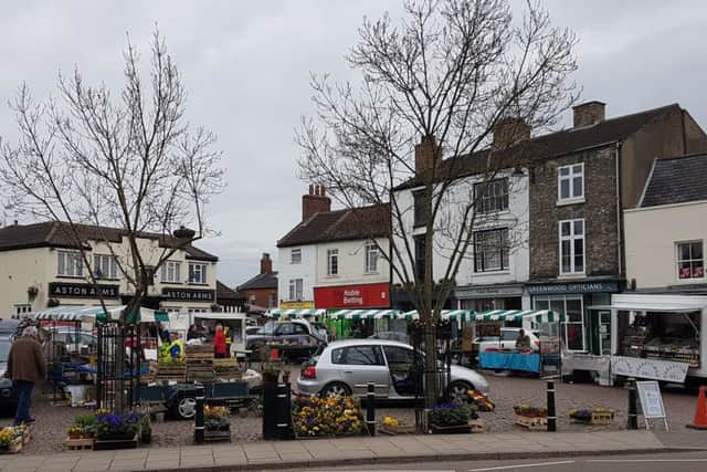 Traders gathered on the Market Place on Tuesday, April 17. EMN-180417-095436001