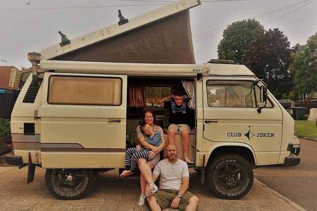The family pictured with their camper van shortly before setting out on their adventure in July, 2017.